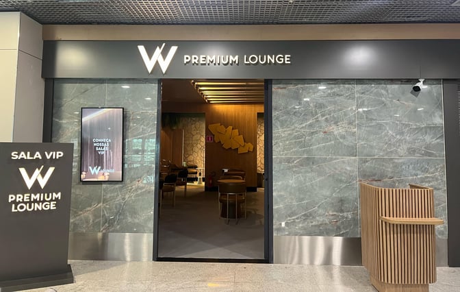 The entrance to the W Premium Lounge at Fortaleza International Airport features a reception area and visible seating inside.