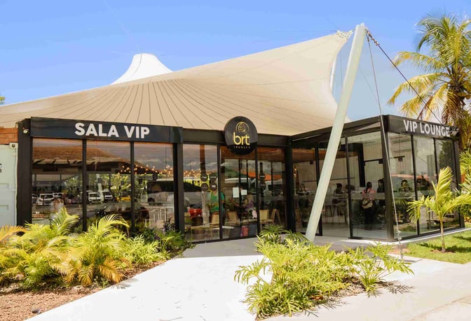 The BRT Lounge entrance at Porto Seguro Airport features glass doors and signage indicating a VIP area for travelers.