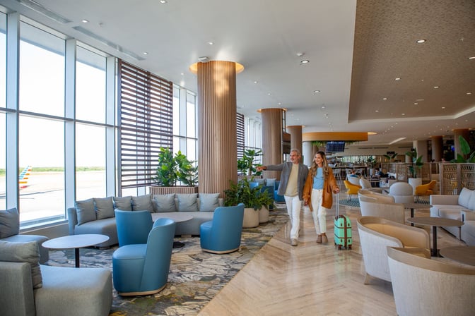 The VIP Lounge at Punta Cana International Airport features spacious seating areas with views of the tarmac and ample natural light.