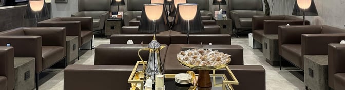 The Hayyak Lounge at Qaisumah–Hafar Al-Batin International Airport features comfortable seating with side tables and a central refreshment station.