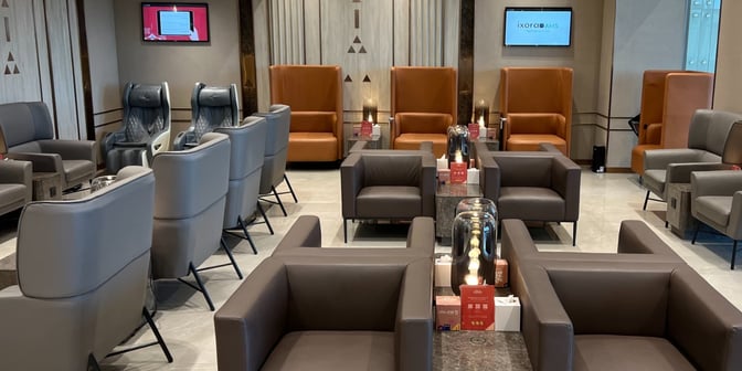 The seating area in Hayyak Lounge at Qaisumah–Hafar Al-Batin International Airport features comfortable chairs and massage seats for relaxation.