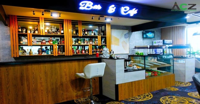 The Blueberry Premium Lounge at Robert Mugabe International Airport features a bar and café with a variety of beverages and snacks.