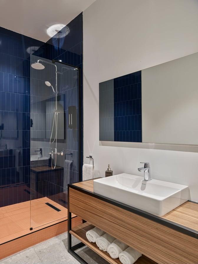 The Kepler Club at Sabiha Gokcen International Airport features a private shower room with a glass-enclosed shower and a sink area.