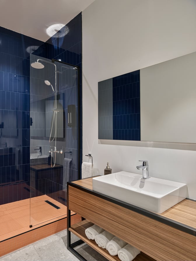 The Kepler Club at Sabiha Gokcen International Airport features a private shower room with a glass-enclosed shower and a sink area.