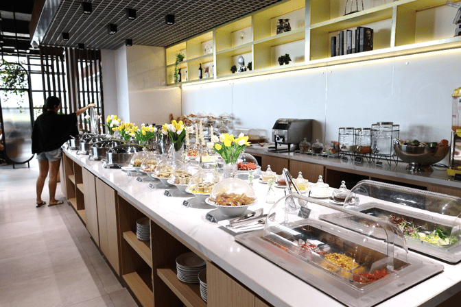The buffet area at Angkor Lounge in Siem Reap–Angkor International Airport offers a variety of self-serve food options.