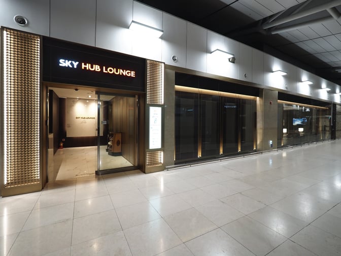 The entrance to the Sky Hub Lounge at Gimpo International Airport features a welcoming reception area with clear signage.
