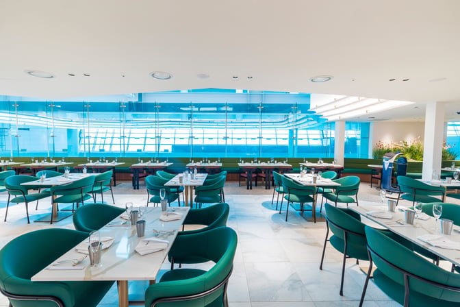 The dining area at MATINA Lounge East, Gate 11, Seoul Incheon Airport, features arranged tables with seating for travelers.