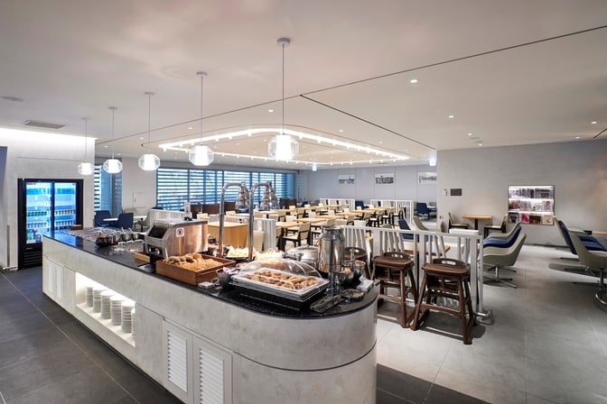 The MATINA Lounge West at Seoul Incheon Airport features a self-serve food station with seating areas near Gate 43.