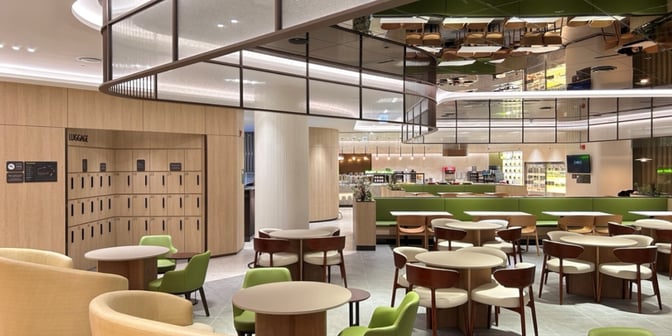 The Sky Hub Lounge at Seoul Incheon International Airport features a seating area with tables and chairs, adjacent to a luggage storage section.