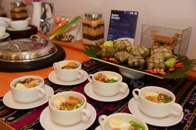 Self-serve food area at Concordia Lounge offers traditional dishes with individual servings and a variety of accompaniments.