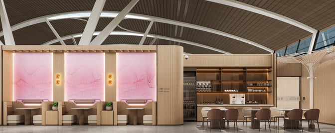 The Juneyao Airlines 72nd VIP Lounge at Shanghai Pudong International Airport features booth seating and a beverage station with various drink options.