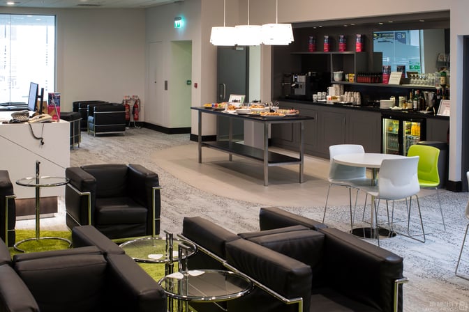The Boru Lounge at Shannon International Airport features a self-serve food area with snacks, beverages, and seating options.