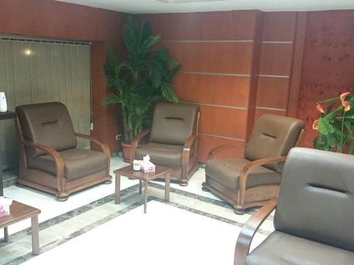 Seating area in Pearl Lounge at Sharm el-Sheikh Airport (Terminal Landside) features comfortable armchairs and small tables, offering a relaxed waiting space.