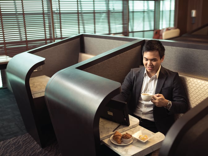 Semi-private booth seating at SATS Premier Lounge in Singapore Changi Airport Terminal 3 offers a comfortable space for dining and relaxation.