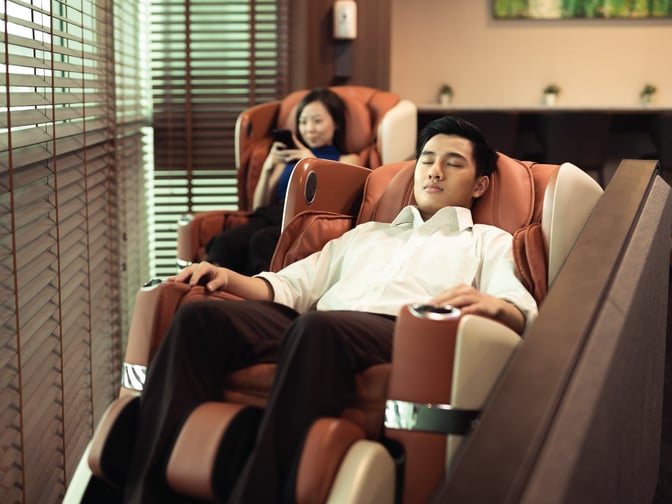 Massage chairs in the SATS Premier Lounge at Singapore Changi Airport Terminal 3 offer relaxation for travelers in a dedicated seating area.
