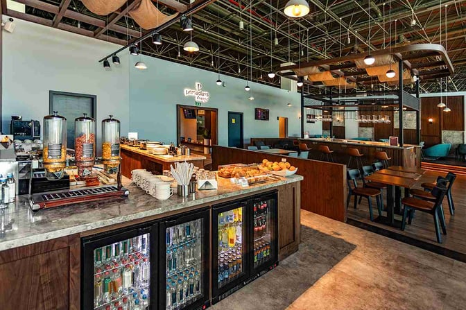 The Primeclass Lounge at Skopje International Airport features a self-serve food station with cereals, pastries, and a selection of beverages.