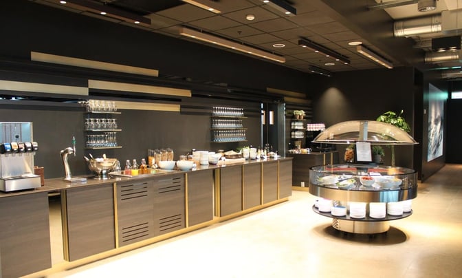 The North Sea Lounge at Stavanger Airport features a self-serve food area with beverages, cereals, and a salad bar.