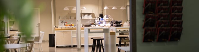 The Pearl Lounge at Stockholm Arlanda Airport features a self-serve food area with various condiments and a coffee machine.