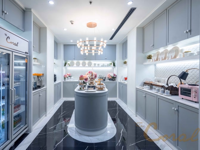 The Coral Finest Business Class Lounge at Suvarnabhumi Airport features a self-serve food area with snacks, beverages, and kitchen appliances.