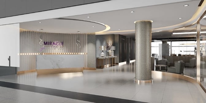 The entrance to the Miracle First Class Lounge at Suvarnabhumi Airport features a reception desk and seating area visible inside.