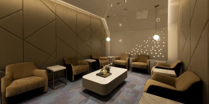 The Oriental Club Lounge at Taiwan Taoyuan International Airport features a seating area with armchairs and a central coffee table.