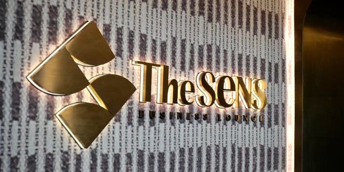 The SENS Business Lounge sign at Tan Son Nhat International Airport marks the entrance to the lounge area.