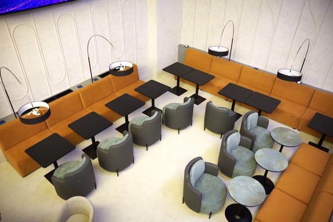 The seating area in Anjir Business Lounge at Tashkent International Airport features sofas, individual chairs, and tables for passenger comfort.