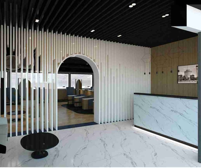 The Prima Vista Lounge at Thessaloniki Airport features a reception area with a marble counter and an arched entrance leading to seating.