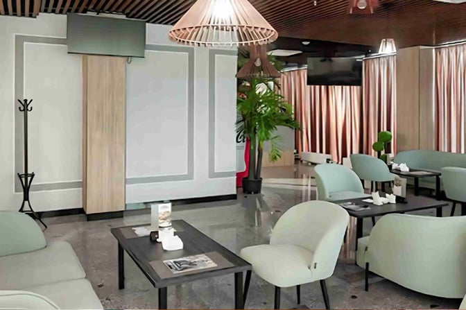 Seating area in Oral Ak Zhol Airport's Business Lounge features comfortable chairs and tables, providing a relaxing space for travelers.