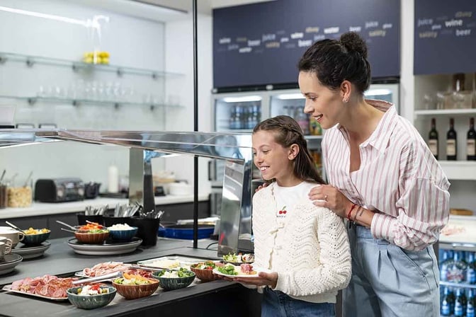 The Fast Track Lounge at Prague Vaclav Havel Airport features a self-serve food station with a variety of salads and cold cuts.
