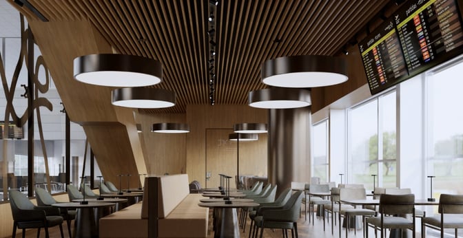 The BRT Lounge at Viracopos–Campinas International Airport features seating areas with tables and a flight information display screen.