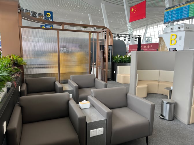 The VIP Reception at Wuhan Tianhe International Airport features comfortable seating with power outlets and semi-private booths for travelers.