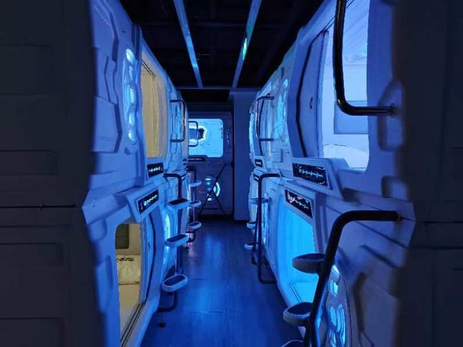 Sleep pods at Wuhan Tianhe International Airport offer private resting spaces with individual access and control panels for travelers.