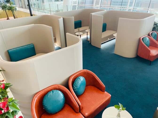 The VIP Reception No.1 at Wuhan Tianhe International Airport features semi-private booth seating with small tables for passenger comfort.
