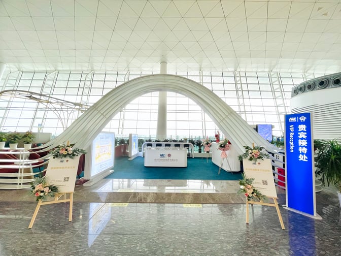 The VIP Reception at Wuhan Tianhe International Airport features a welcoming entrance with signage and floral arrangements, leading to a reception desk.