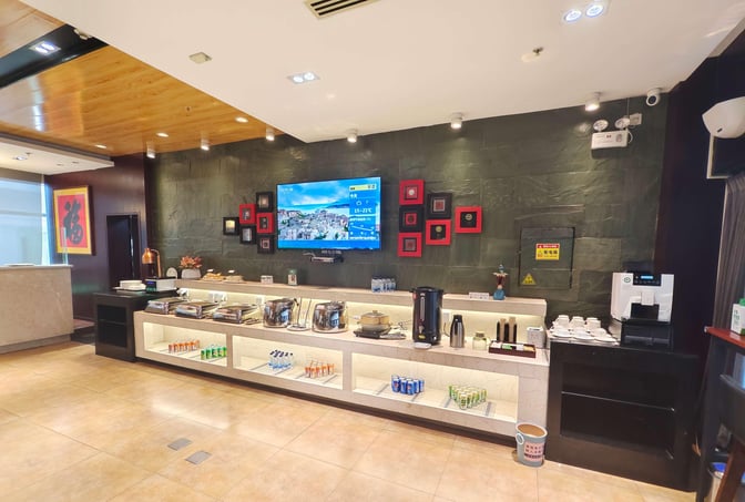 The First Class Lounge No. 3 at Xi'an Xianyang International Airport features a self-serve food and beverage station with various refreshments.