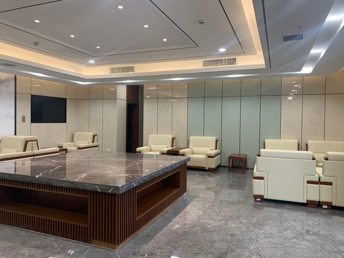 The seating area in International First Class Lounge 3 at Yuncheng Guangong Airport features arranged armchairs and a central table.
