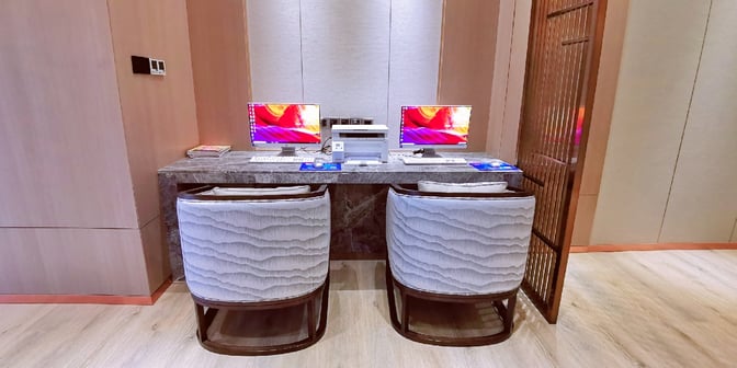 The business center in the No. 1 VIP Lounge Landside at Zhangjiajie Hehua Airport features two computer stations and a printer for passenger use.