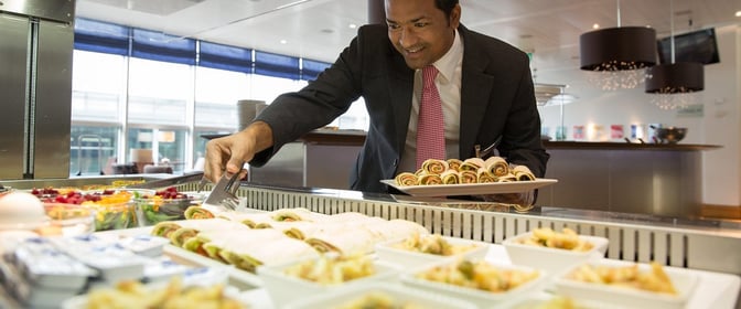 Self-serve food station at Aspire Lounge, Zurich Airport, offers a variety of wraps and salads for guests.