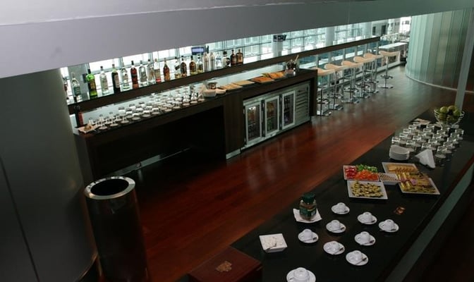 The Converse Bank Business Lounge at Zvartnots Airport features a bar with a variety of spirits and a self-serve food area.